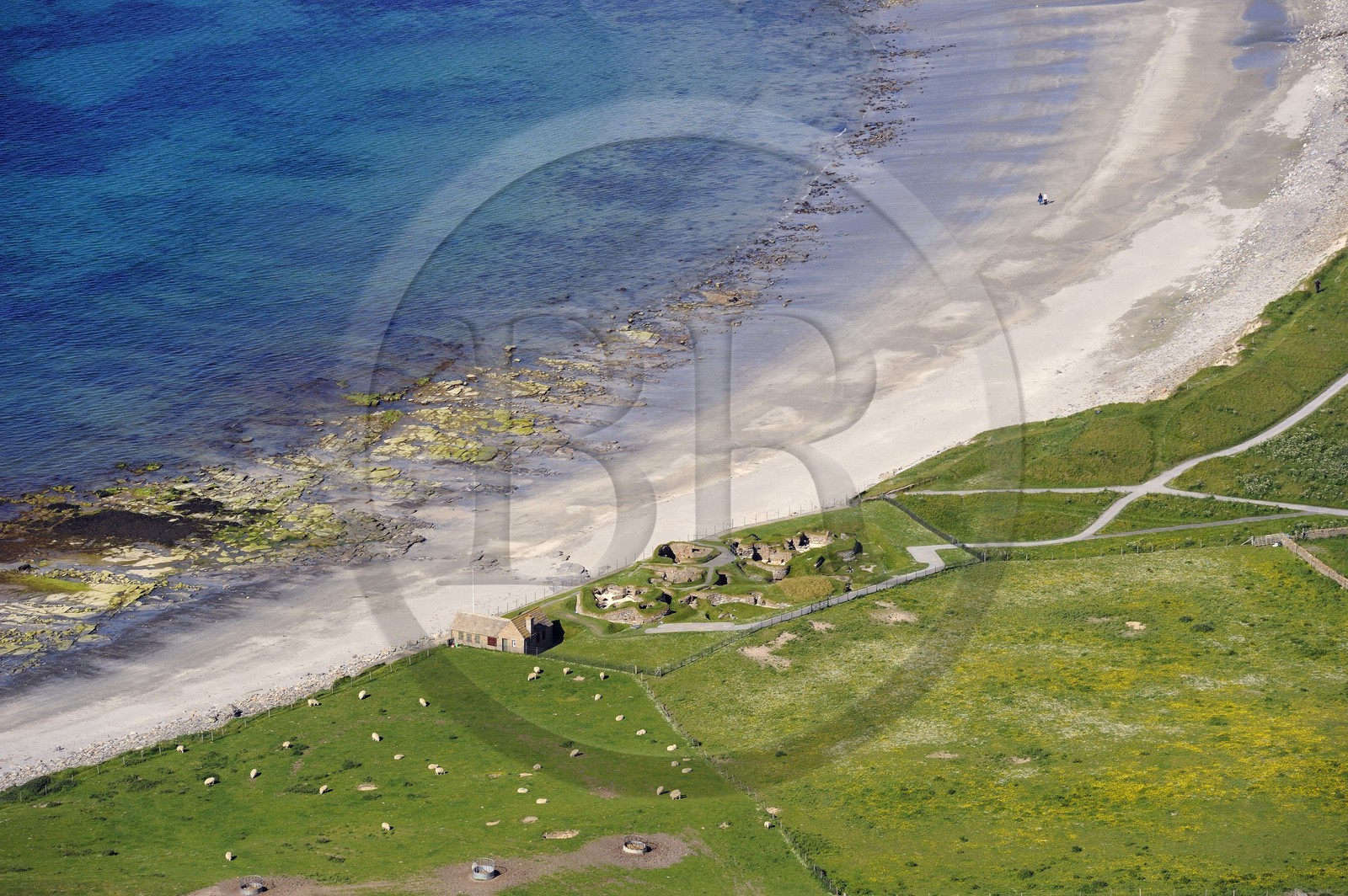 United Kingdom, Scotland, Orkney Islands, Mainland Island, ruins of Skara Brae prehistoric village, listed as World Heritage by UNESCO and the Bay of Skaill (aerial view)