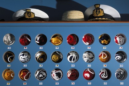 Italy, cruise aboard the Silvershadow ship of the company Silversea, flags locker and caps of officers