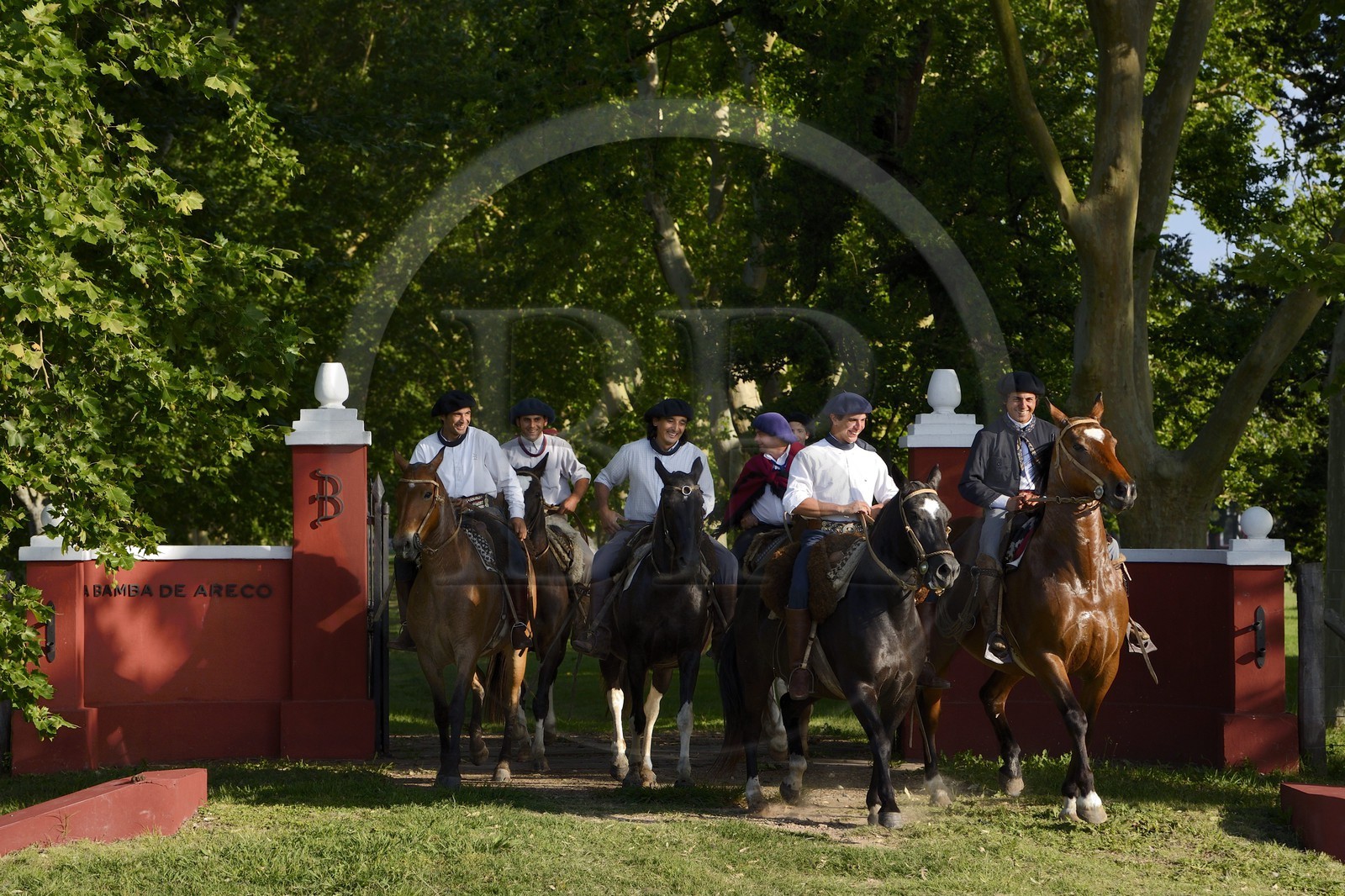 Argentina, Buenos Aires Province, San Antonio de Areco, group of gauchos on horseback leaving the estancia La Bamba de Areco