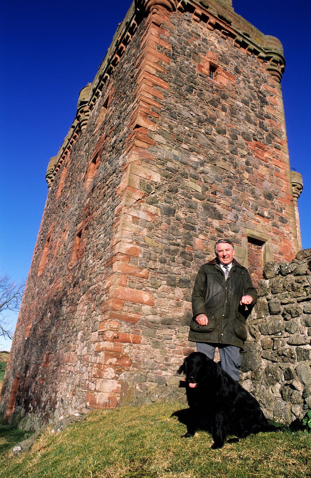 United Kingdom, Scotland, Perthshire and Kinross, portrait of Sir David Steel in front of Balvaird Castle