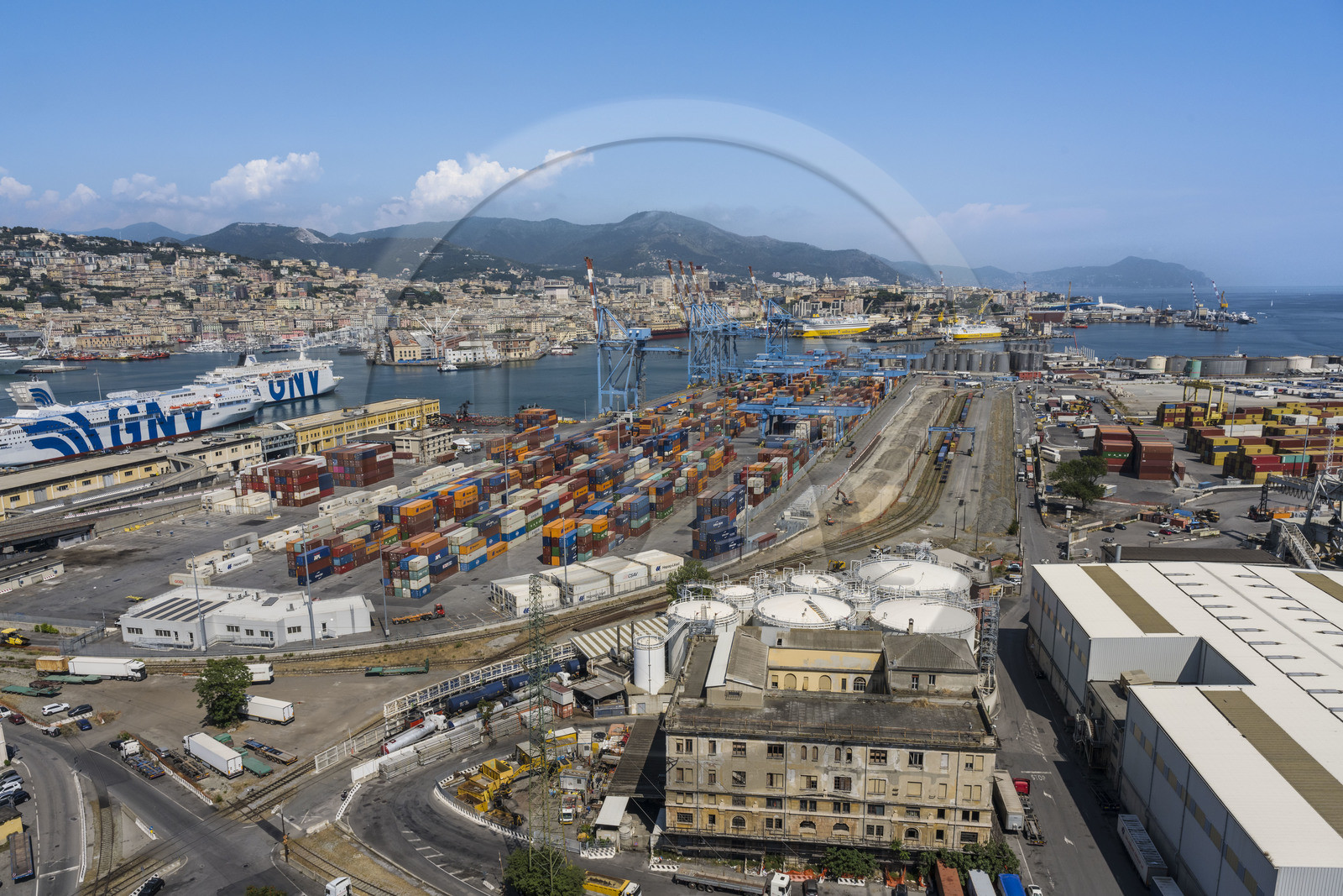 Italy, Liguria, Genoa, the container terminal of the commercial port and the city in the background