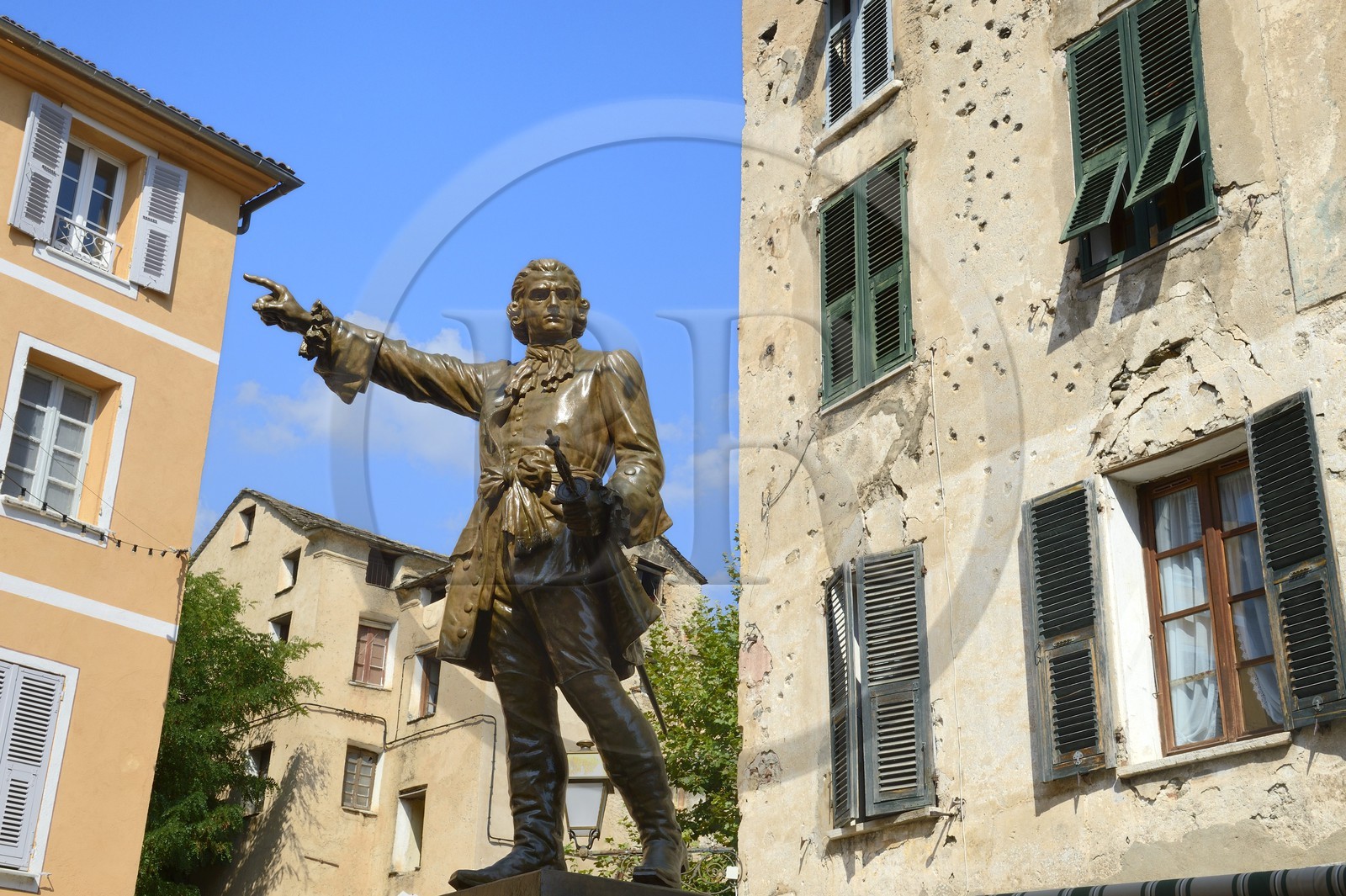 France, Haute Corse, Corte, the statue of a hero of the corsican revolution general Gaffori in front of his birthplace still riddled with bullet holes from 1750
