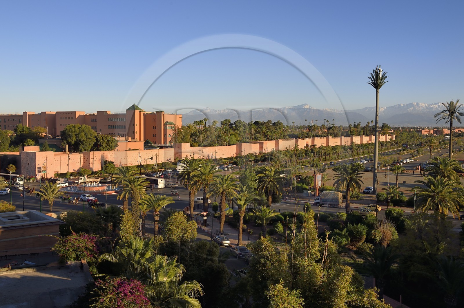 Morocco, High Atlas, Marrakech, Imperial city, Medina listed as World Heritage by UNESCO, Mamounia luxury hotel behind the ramparts of the city and the snow-covered Atlas in the background