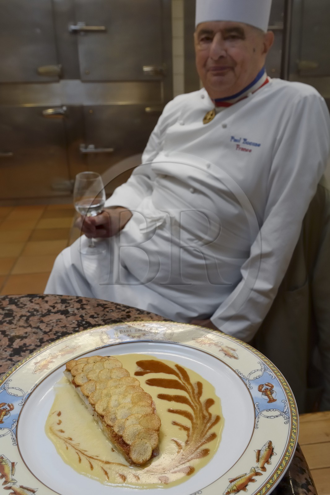 France, Rhone, Collonges au Mont d'Or, Paul Bocuse Restaurant L'Auberge du Pont de Collonges, three Michelin stars since 1965, famous French chef Paul Bocuse, red mullet dressed in crusty potato scales