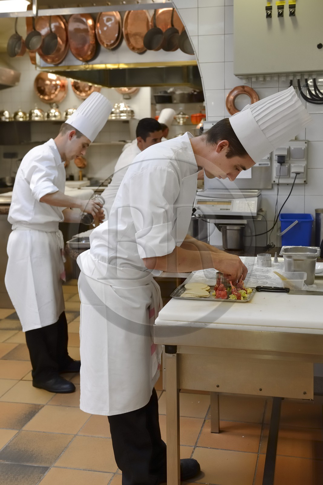 France, Rhone, Collonges au Mont d'Or, Paul Bocuse Restaurant L'Auberge du Pont de Collonges, three Michelin stars since 1965, the Paul Bocuse kitchen brigade at work