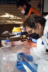 France, Bas-Rhin, Schiltigheim, intervention of two engineers from the National Agency for the Management of Radioactive Waste (Andra) in a private home to remove radioactivity from a rare model of a century-old radium fountain, decontamination of the glass by friction