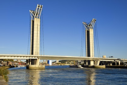 France, Seine Maritime, Rouen, barge passing under the Gustave Flaubert lift bridge over the Seine river
