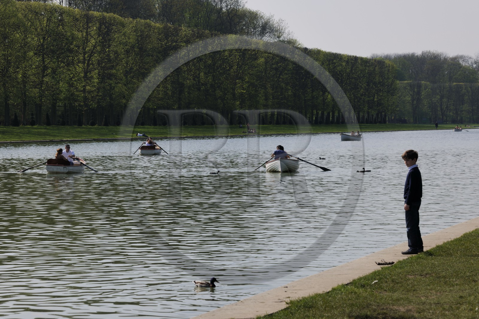 France, Yvelines, park of the Chateau de Versailles, listed as World Heritage by UNESCO, small boats on the Grand Canal