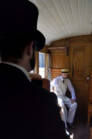 France, Alpes de Haute Provence, between Annot and Saint-Benoit, Train des Pignes historic train, members of the AHVAE (Association d'histoire vivante et de d'archeologie expérimentale) in Belle Epoque costume in a passenger car from 1892