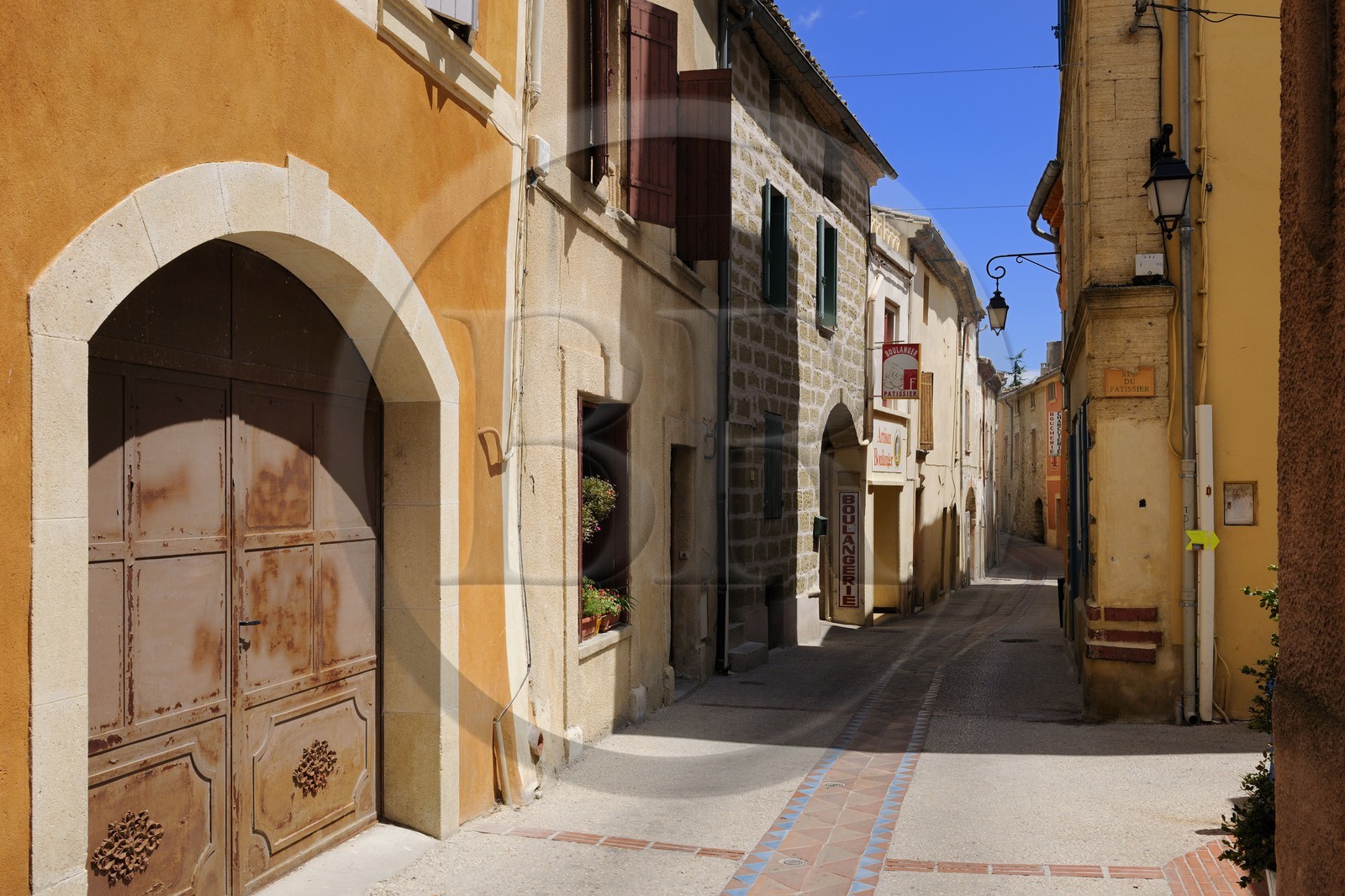 France, Gard, region of the Pays d'Uzege, Saint-Quentin-la-Poterie, the Grand'Rue (main street), the water drainage are also tiled