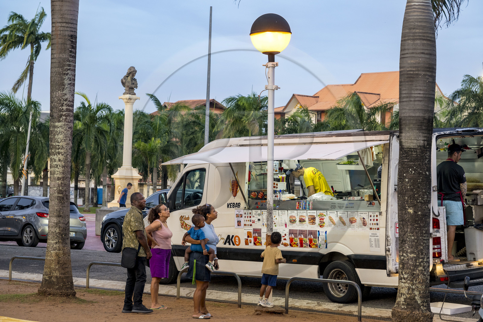 France, French Guiana, Cayenne, a key meeting point for Cayenne residents, the Place des Palmistes hosts food trucks in the evening under the bust of Marianne