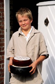 Belgium, West Flanders, De Panne region around De Moeren, the son of the cheese producer on his farm