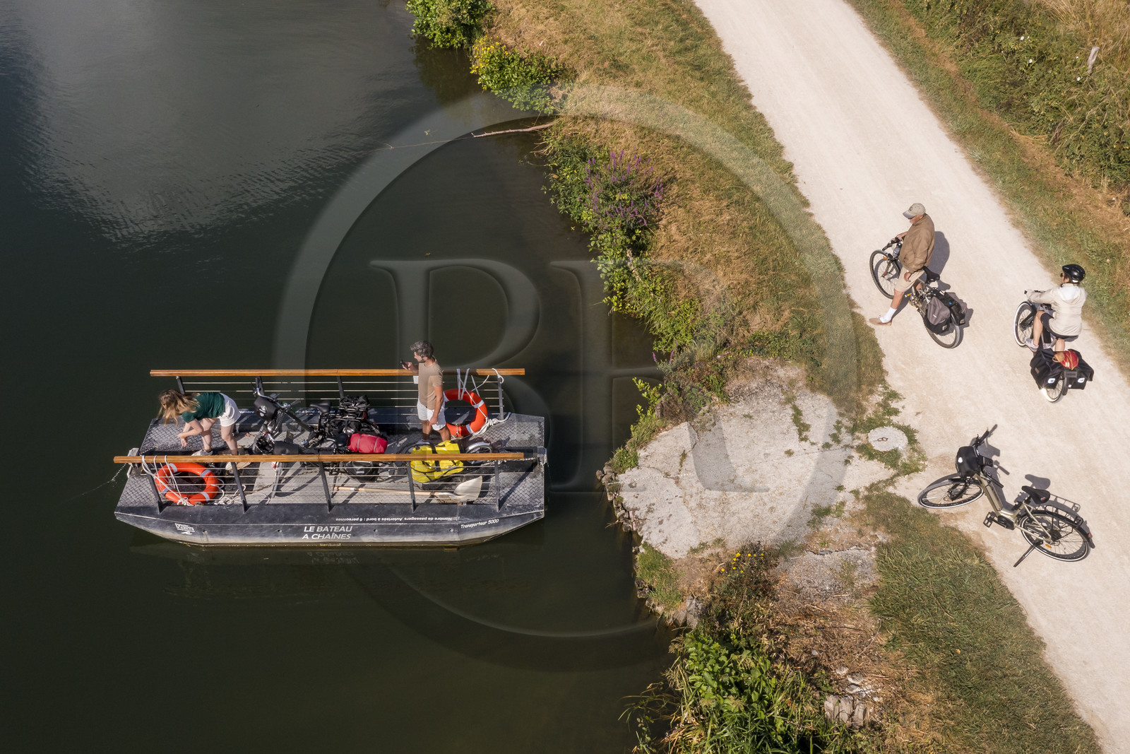 France, Deux-Sèvres, le Marais Poitevin, Green Venice, Magné, bicycle journey, passage of the Sèvre Niortaise river on one of the chain boats in free access (aerial view)