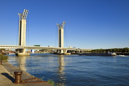 France, Seine Maritime, Rouen, barge passing under the Gustave Flaubert lift bridge over the Seine river