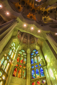 Spain, Catalonia, Barcelona, Eixample district, Sagrada Familia basilica by Catalan modernist architect Antoni Gaudi, listed as a UNESCO World Heritage Site, stained glass windows of the apse above the ambulatory by the Catalan painter and glassmaker Joan Vila-Grau
