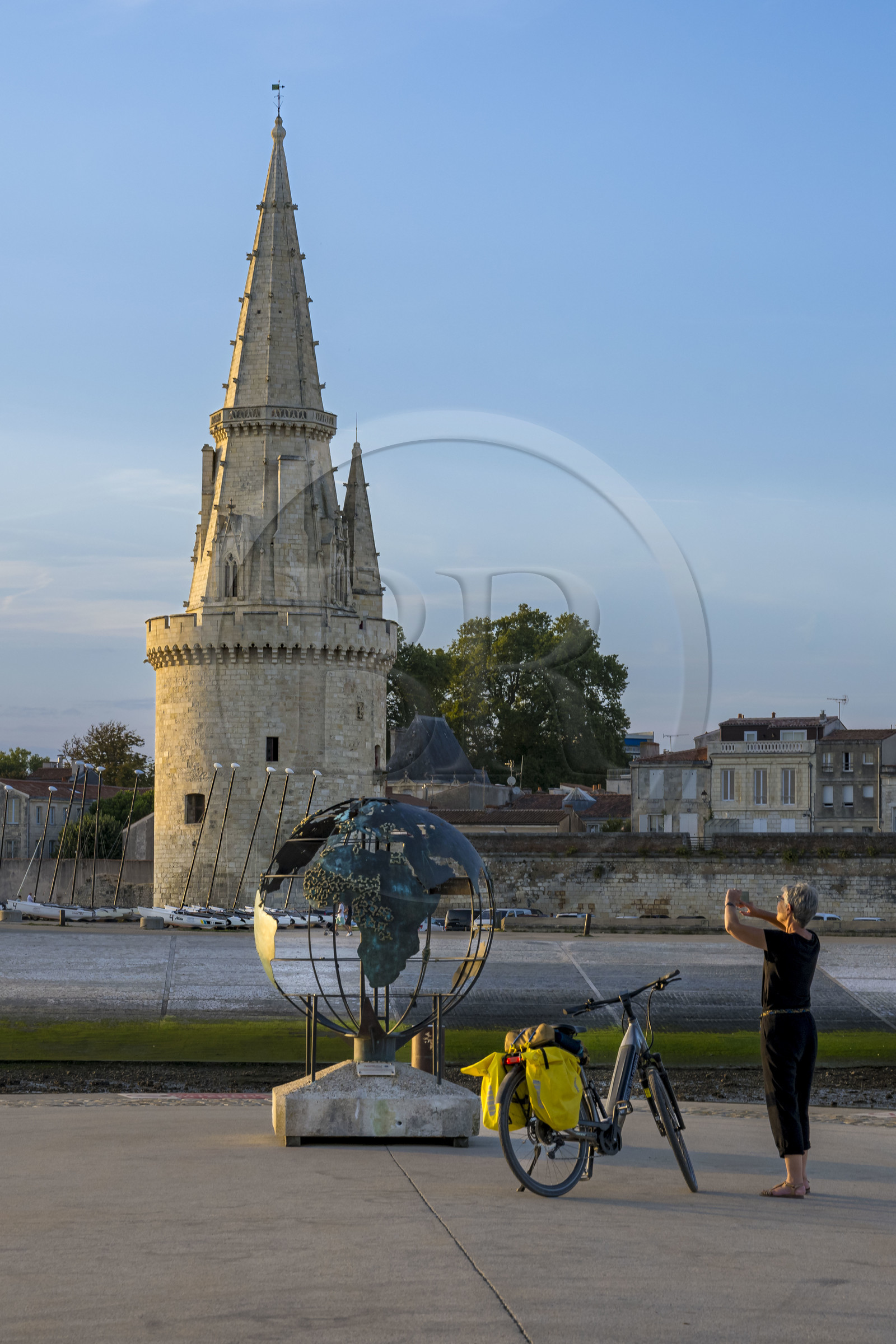 France, Charente Maritime, La Rochelle, the Old Port entrance, the tour de la Lanterne and globe of the Francophonie, bronze by Bruce Krebs, on the Esplanade Saint-Jean d'Acre