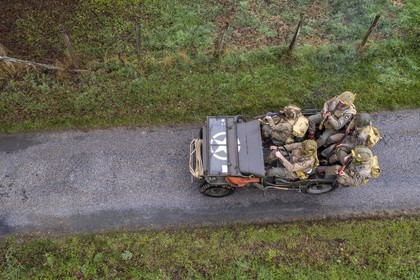 France, Eure, Sainte Colombe prés Vernon, Allied Reconstitution Group (US World War 2 and french Maquis historical reconstruction Association), reenactors in uniform of the 101st US Airborne Division progressing in a jeep Willys (aerial view)