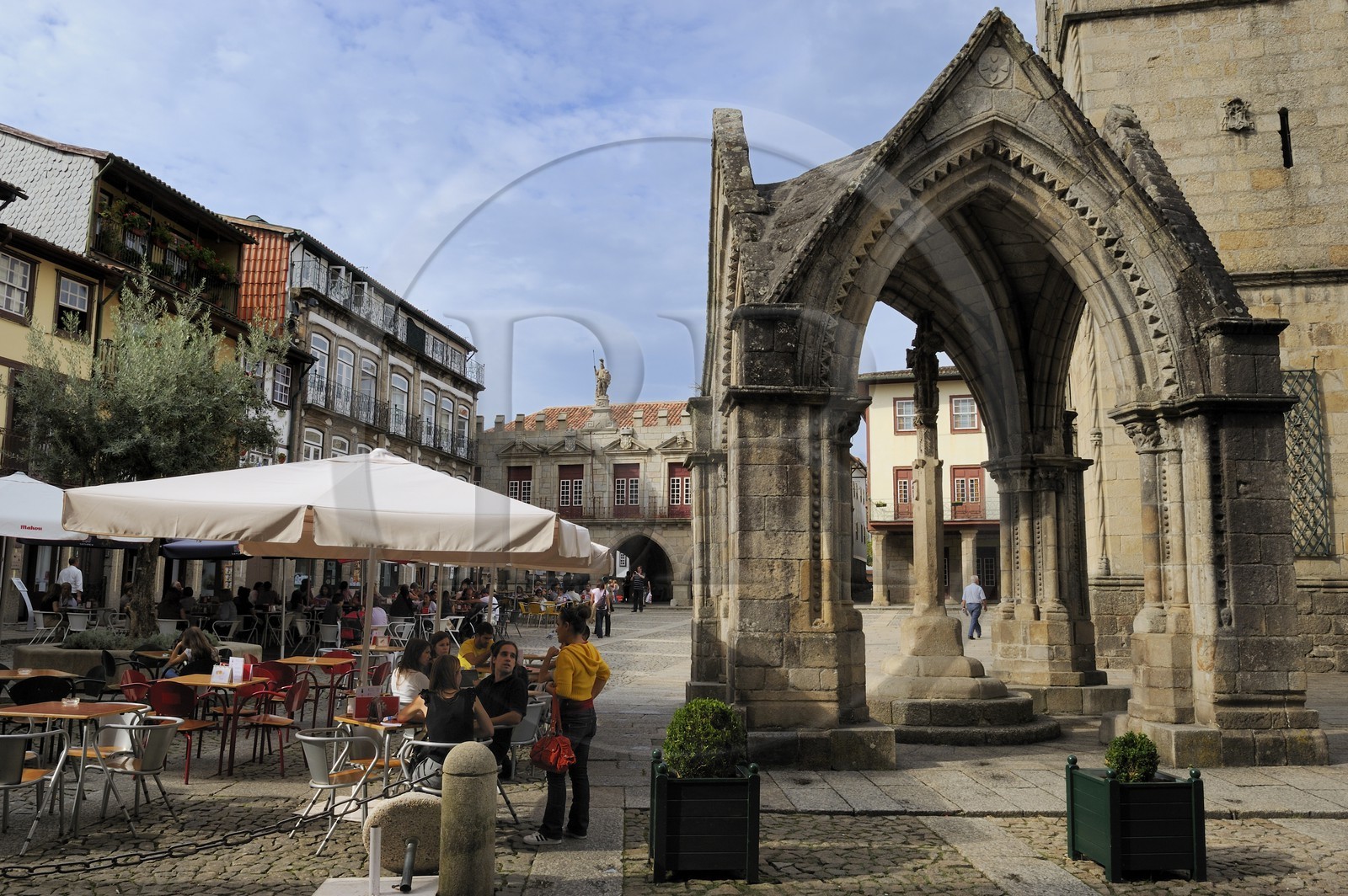 Portugal, Minho region, Guimaraes, town listed as World Heritage by UNESCO, gothic belvedere in front of the Church of Nossa Senhora da Oliveira on Largo da Oliveira square