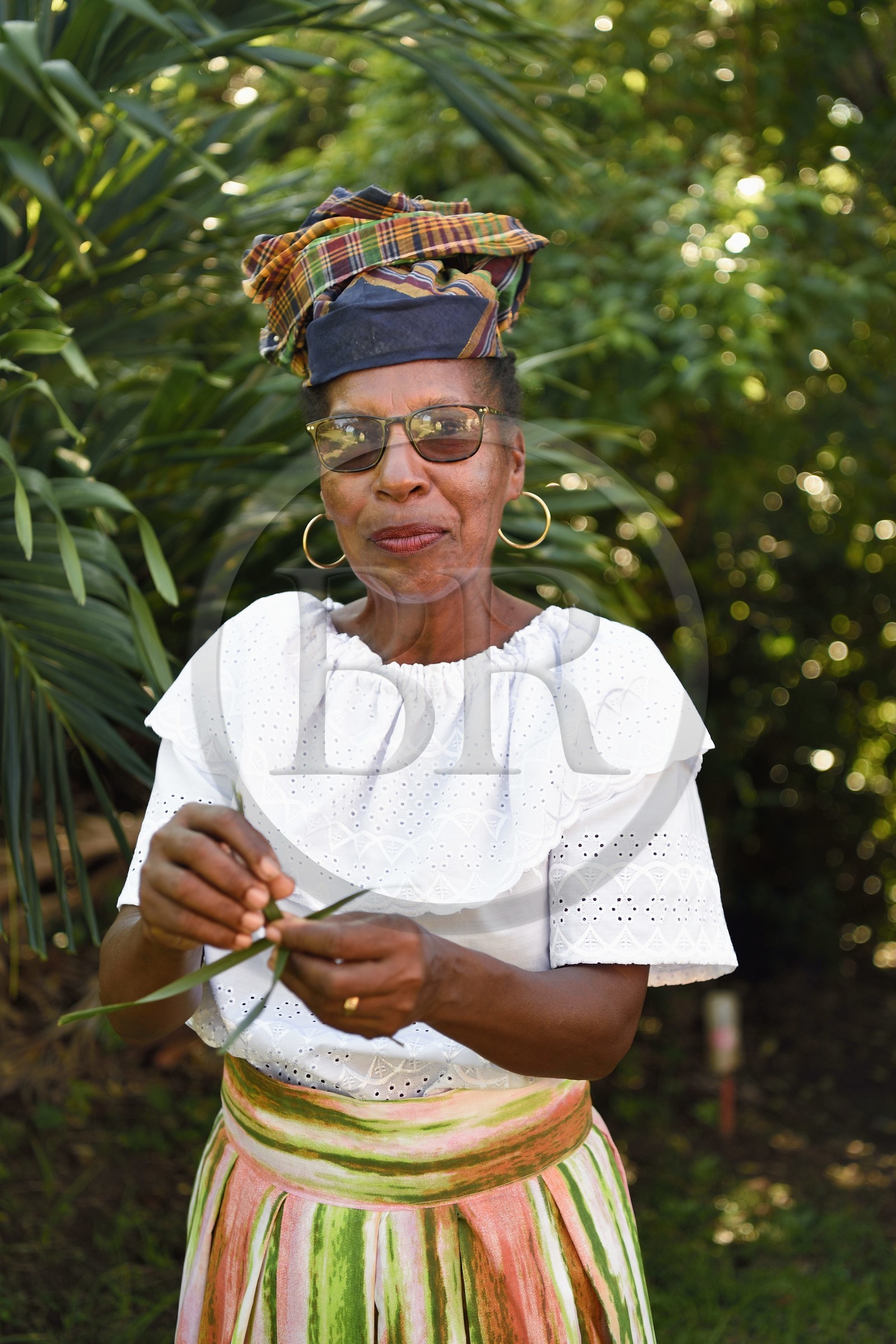 Caribbean, Dominica Island, Grand Fond site in the north of the island, Gillis in traditional Dominica dress after mass
