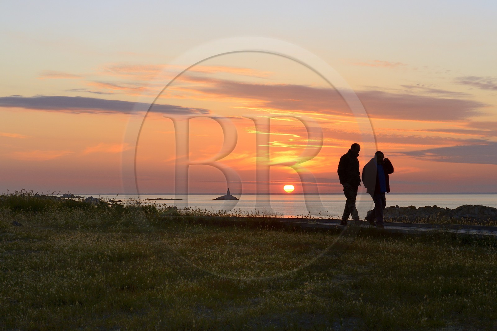 France, Finistere, La Foret Fouesnant, Glenan islands, St Nicolas Island, sunset on the west coast and the former Huic lighthouse now abandoned