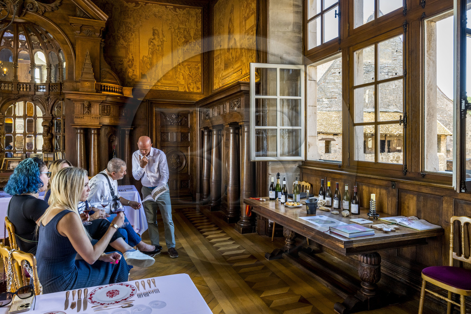France, Cote d'Or, cultural Landscape of the climates of Burgundy listed as World Heritage by UNESCO, Route des Grands Crus (road of Vintage Wines), vineyard of the Côte de Nuits, Vougeot, the Chateau of Clos de Vougeot, wine tasting at La Table de Léonce Bocquet by a sommelier in the former dining room of the manor