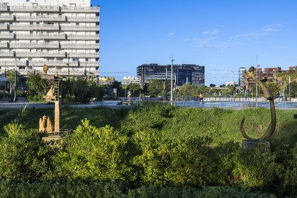 France, Herault, Montpellier, Port Marianne district, sculptures on the edge of the water mirror on avenue Raymond Dugrand and the City Hall in the background