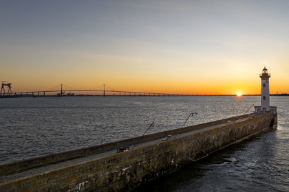 France, Loire-Atlantique, Saint-Nazaire, the Vieux Mole lighthouse and the Saint Nazaire bridge in the background (aerial view)