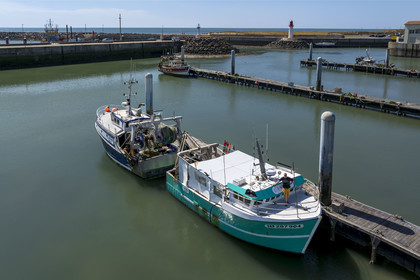 France, Charente Maritime, Oleron island, port of La Cotinière, flood basin built in 2022 at the foot of the new fish market, fisherman Yoann Crochet on his trawler L'Univers intended for artisanal coastal fishing (aerial view)