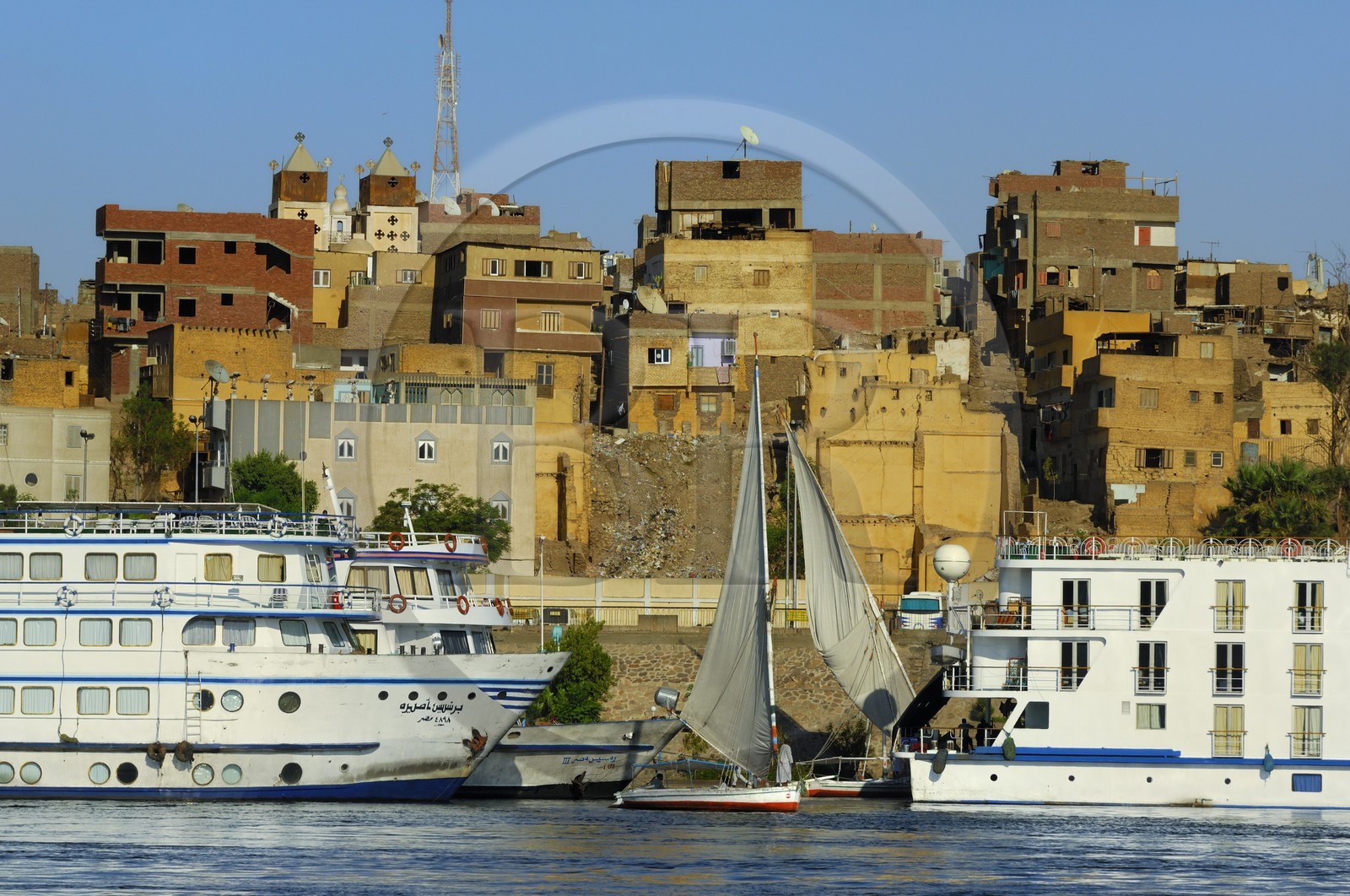 Egypt, Upper Egypt, Nubia, Nile Valley, Aswan, felucca and cruise ship on the Nil