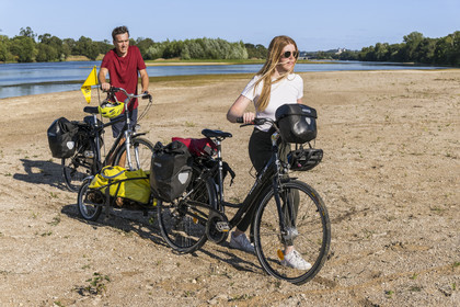 France, Maine-et-Loire, Loire valley listed as World Heritage by UNESCO, Saumur towards Saint-Hilaire, sandbanks forming islands on the Loire, cycling on the banks of the Loire, bike with a trailer carrying camping equipment