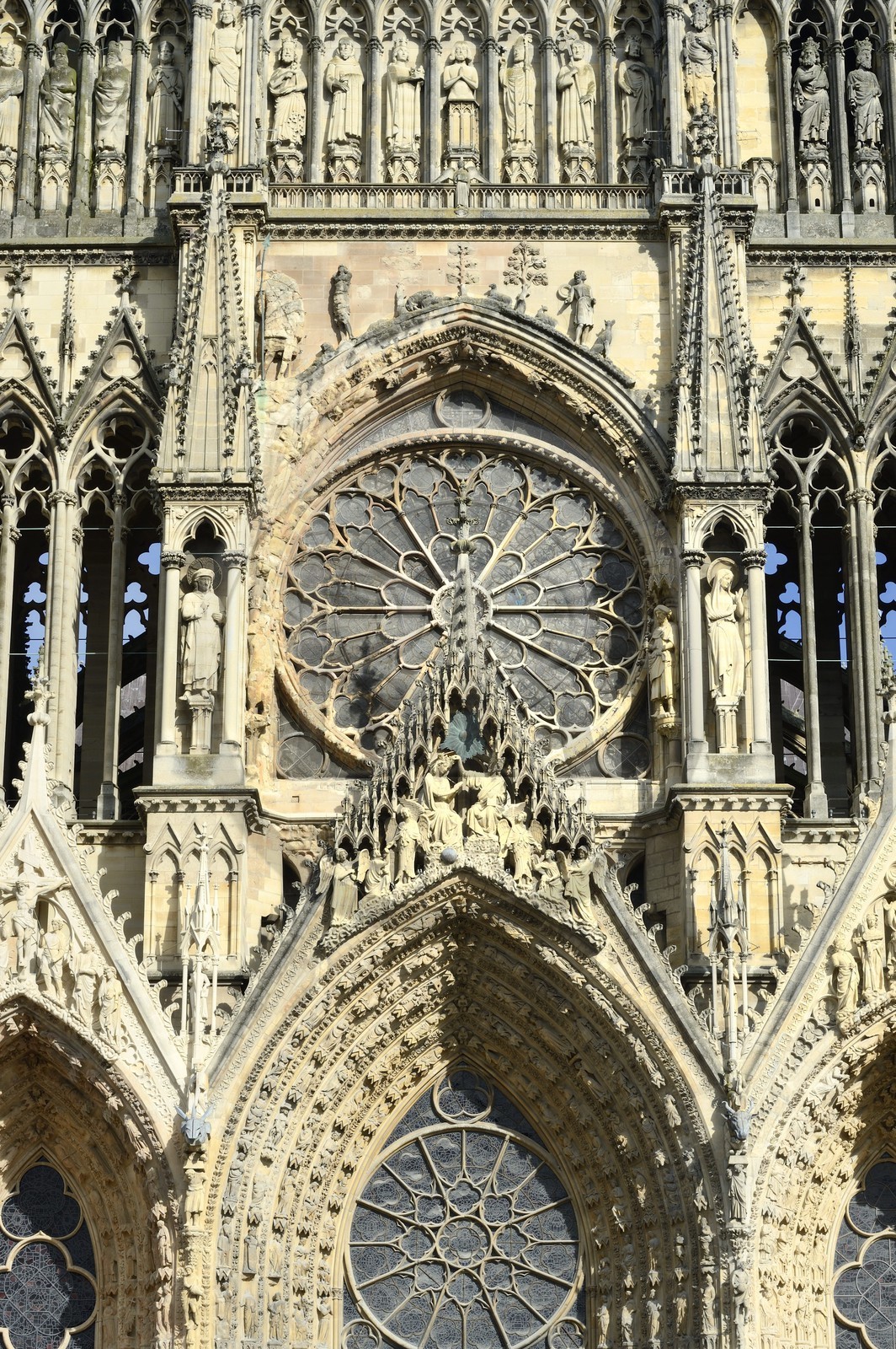 France, Marne, Reims, Notre-Dame de Reims cathedral, listed as World Heritage by UNESCO, the western facade, Baptism of Clovis (center) by the Bishop Saint Remi and the large rose window