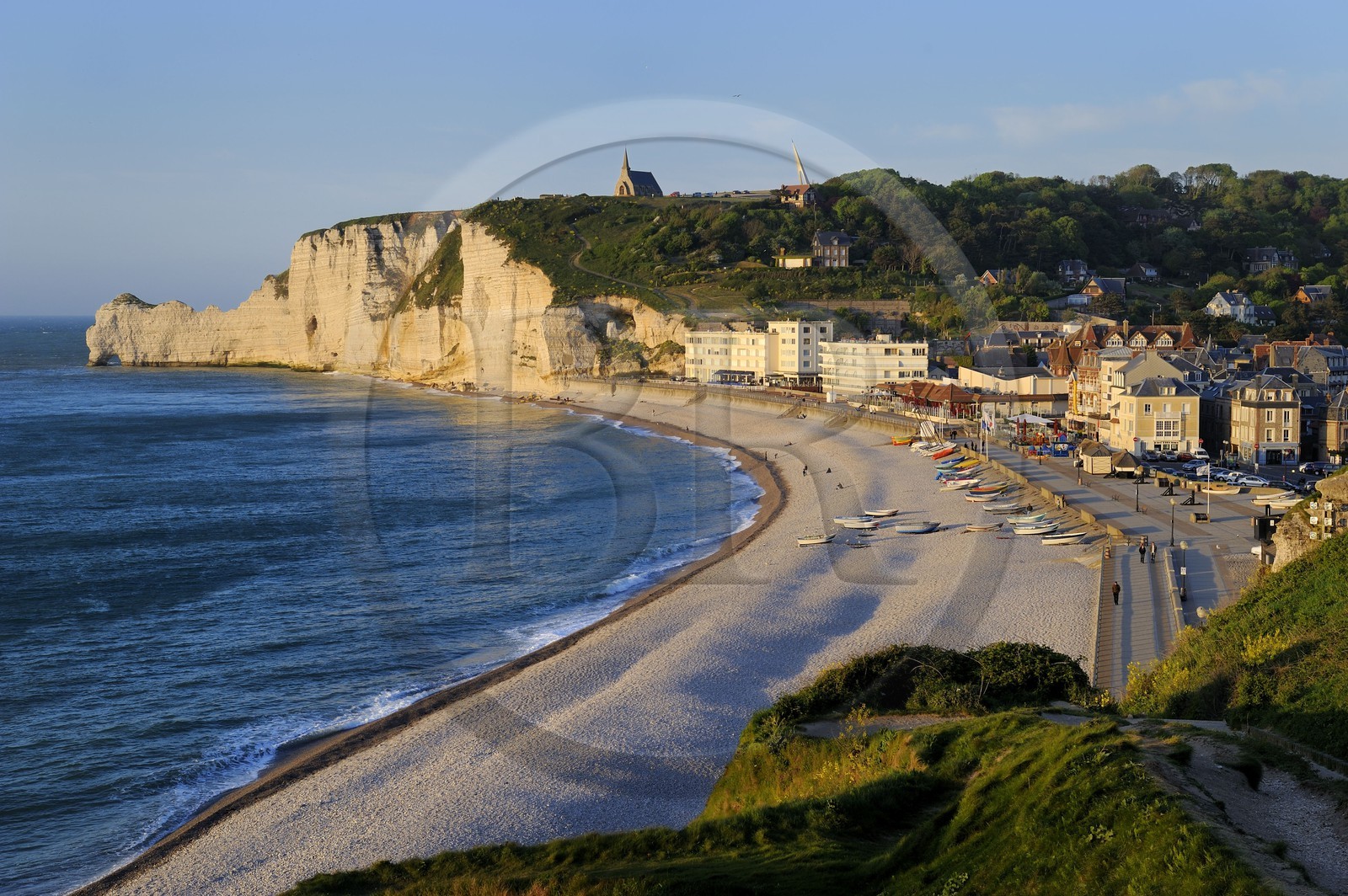 France, Seine-Maritime, Pays de Caux, Cote d'Albatre, Etretat and it's beach, in the background the Amont cliff and Notre-Dame-de-la-Garde church