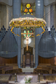 Spain, Catalonia, Barcelona, Eixample district, Sagrada Familia basilica by Catalan modernist architect Antoni Gaudi, listed as a UNESCO World Heritage Site, the presbyterium, a choir reserved for the clergy, surmounted by the crucified Christ hanging from a suspended canopy