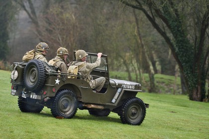 France, Eure, Sainte Colombe prés Vernon, Allied Reconstitution Group (US World War 2 and french Maquis historical reconstruction Association), reenactors in uniform of the 101st US Airborne Division progressing in a jeep Willys