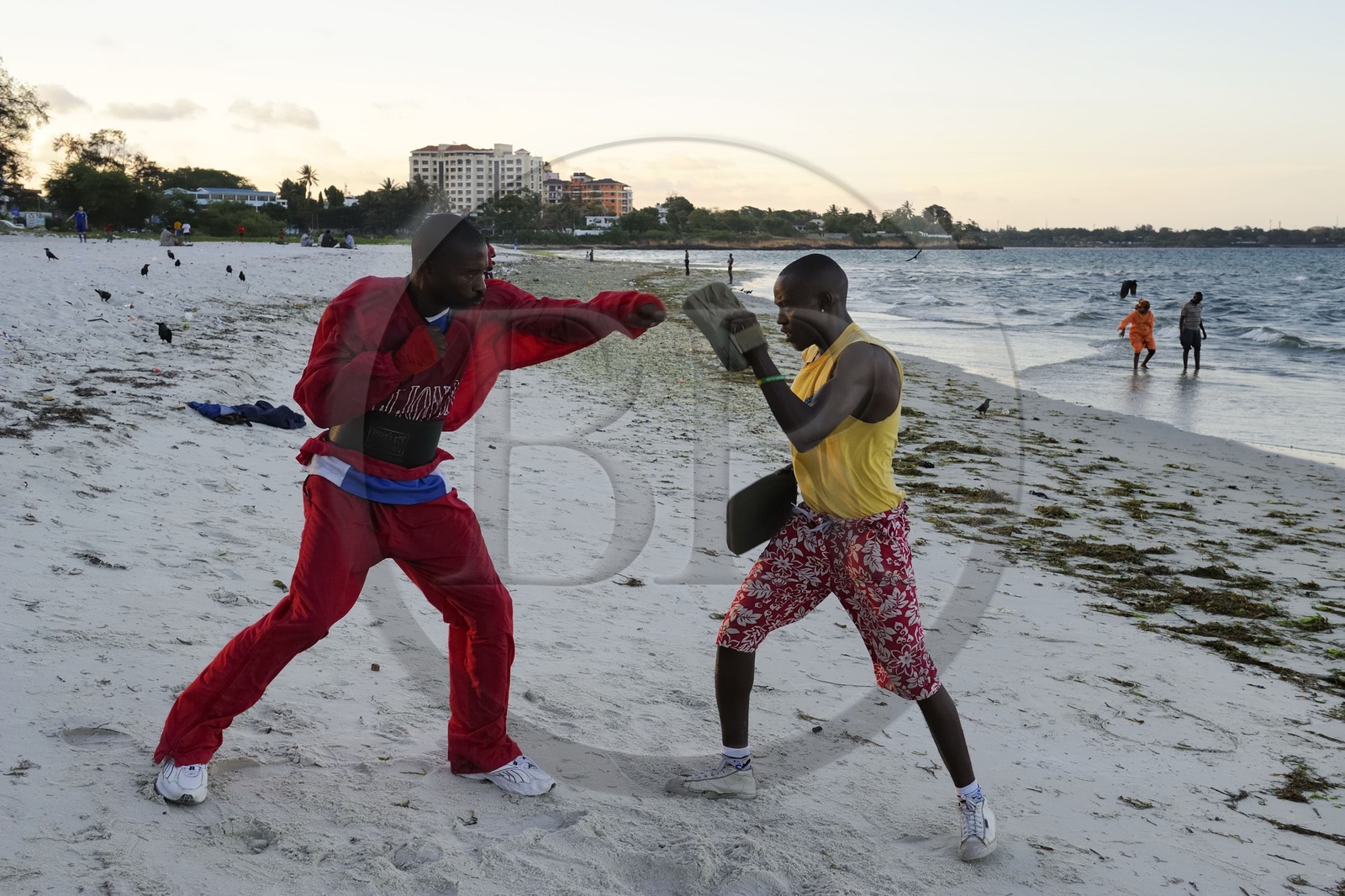 Tanzania, Dar es-Salaam, amateur boxer training on the beach at Ocean Road in the neighborhood Kivukoni