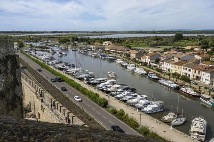 France, Gard, Aigues Mortes, the port of the Rhone to Sète canal at the foot of the ramparts of the old town
