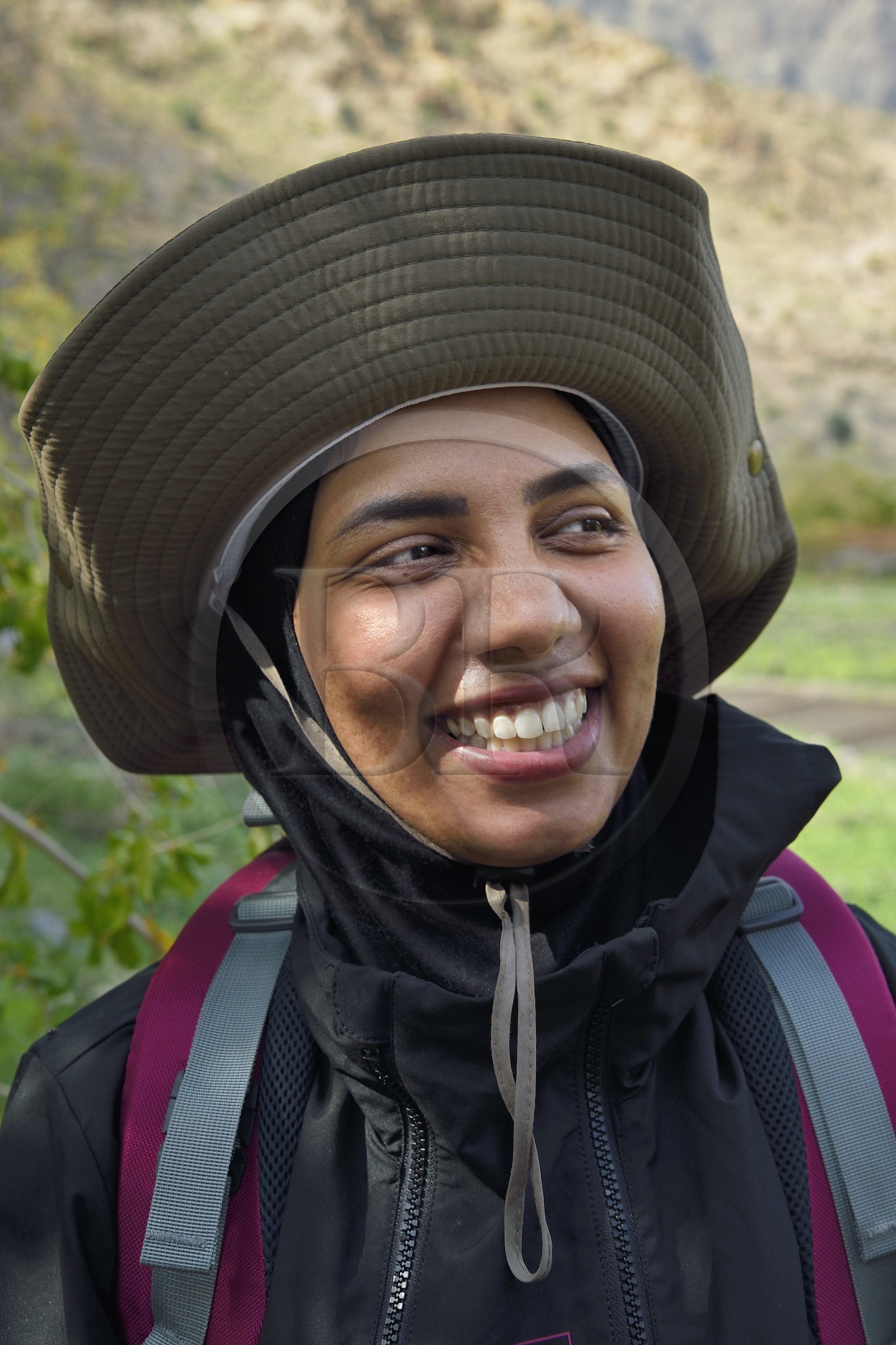 Sultanate of Oman, South Batinah Governorate, Western Hajar, Wadi Mistall, the hiker Badour Al Salhi in the terraced crops overlooking the village of Wakan (Wukan)