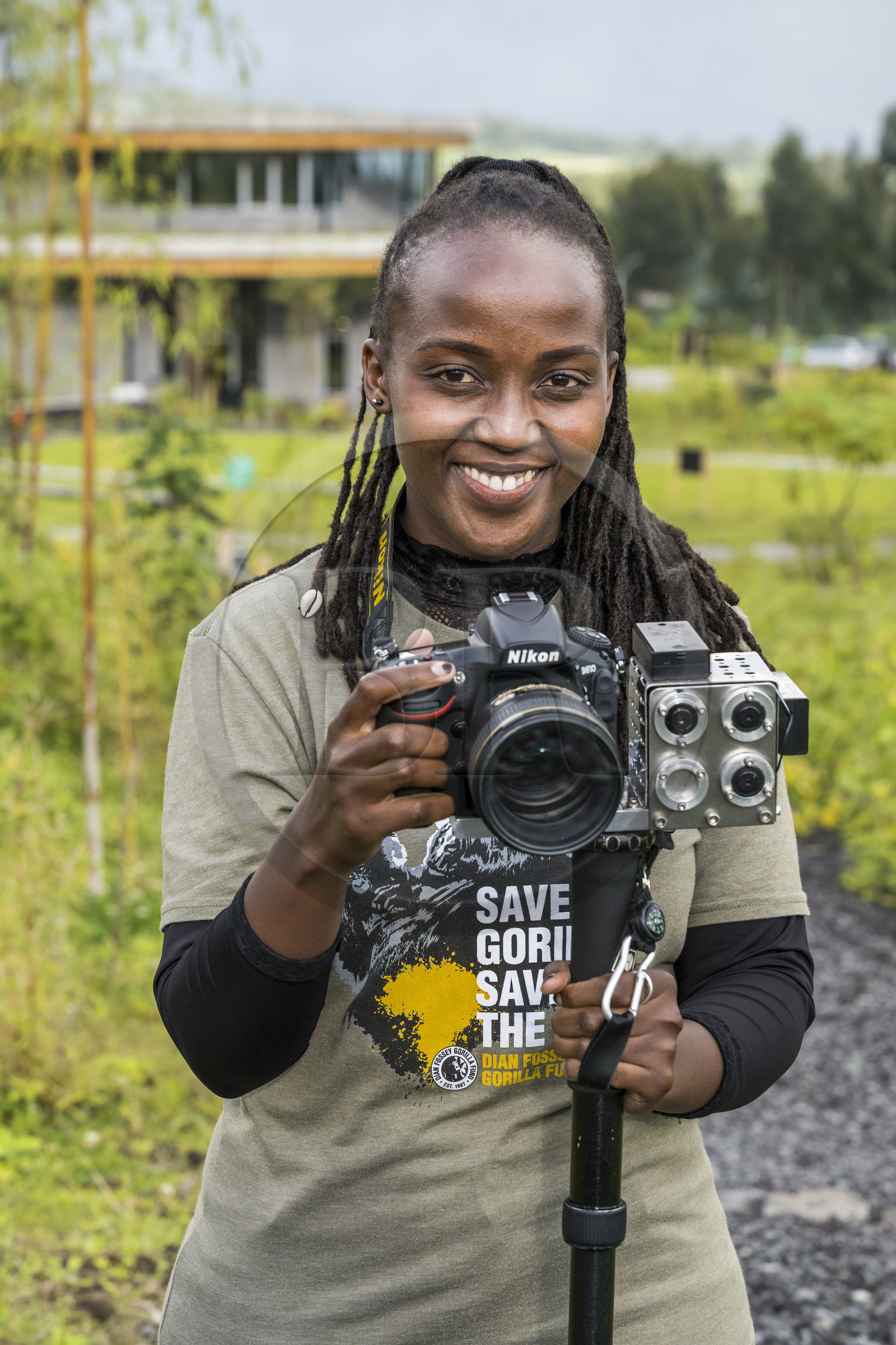 Rwanda, Northern Province, Musanze (Ruhengeri) District, Kinigi, Ellen DeGeneres Campus of the Dian Fossey Gorilla Fund, Rwandan zoologist Nadia Niyonizeye armed with her laser-equipped camera to study the evolution of gorilla growth in the field