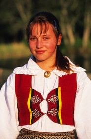 Estonia (Baltic States), Saaremaa Island, Mustila village, girls in traditional suit