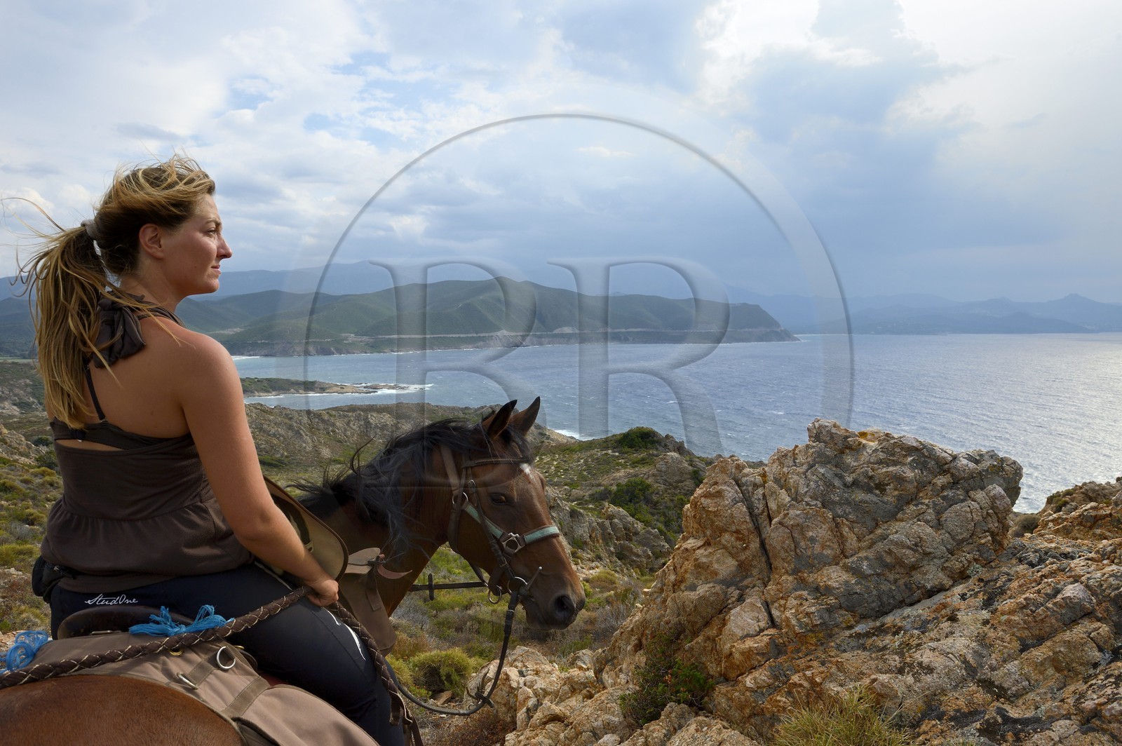 France, Haute Corse, Nebbio, Agriates Desert, Peraiola Cove, rider on the North-East of Ostriconi beach on the Punta di l’Acciolu (Acciola)