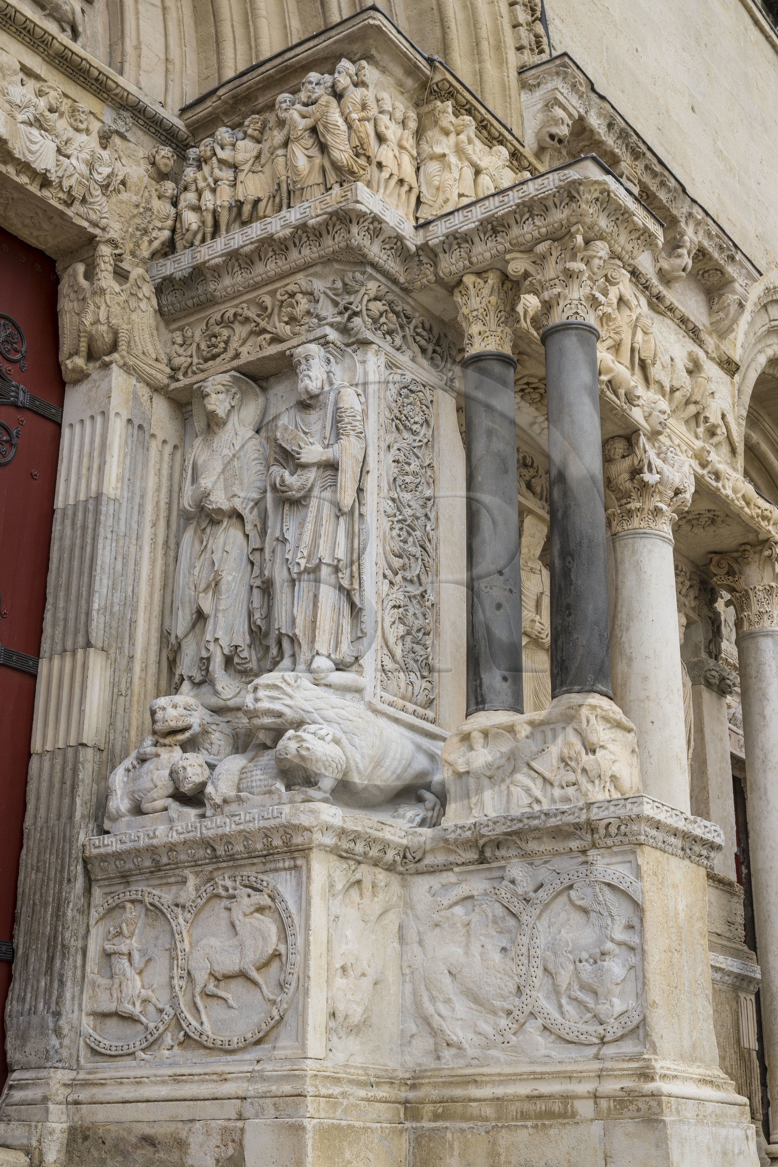 France, Gard, Saint Gilles du Gard, 12th-13th century Abbey Church of Saint-Gilles, classified as World Heritage by UNESCO under the routes to Santiago de Compostela in France, sculptures of the eastern facade of Provencal Romanesque style, corinthian capital, statue representing St. Peter on the left