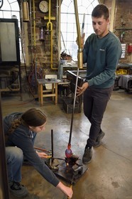 France, Moselle, Meisenthal, Centre international d'Art verrier (CIAV) (international glass centre), the blowing workshop, crafting a Christmas ball, mechanical blowing with mold