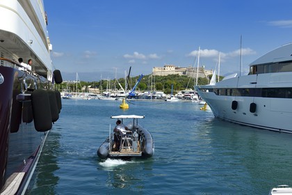 France, Alpes-Maritimes, Antibes, Billionaires dock in the marina and Fort Carré in the background