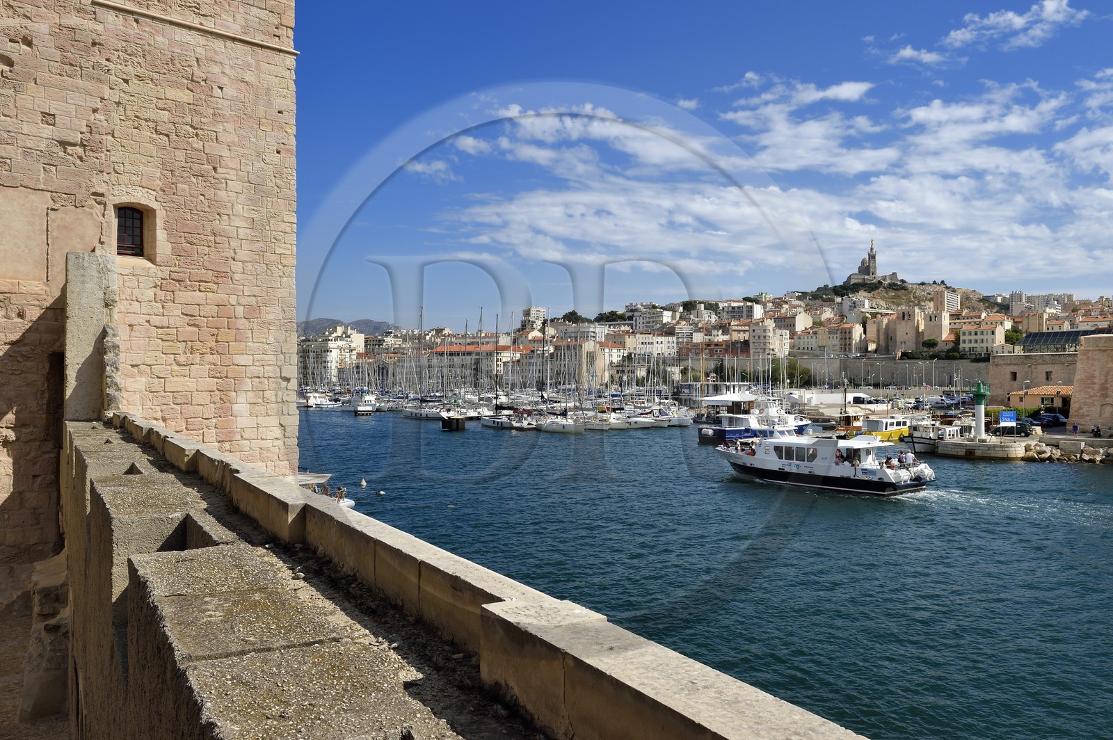France, Bouches du Rhone, Marseille, the Fort Saint Jean, the Vieux Port entrance and Notre Dame de La Garde in background