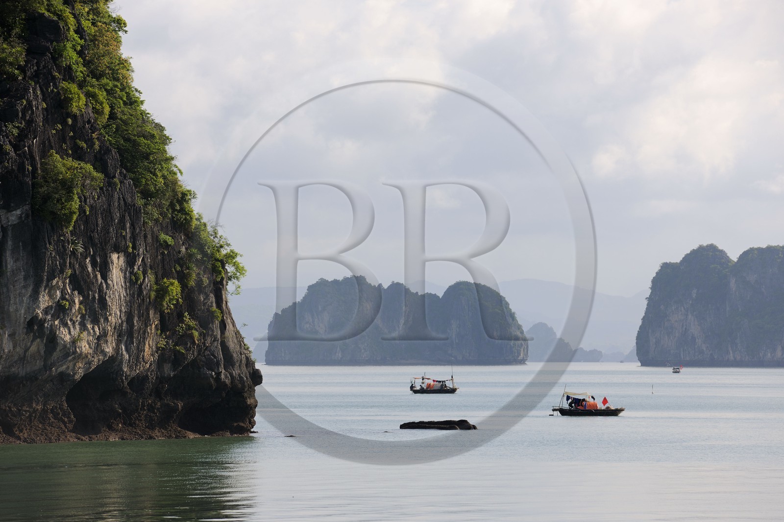 Vietnam, Quang Ninh Province, Halong Bay, listed as World Heritage by UNESCO, fishing boat