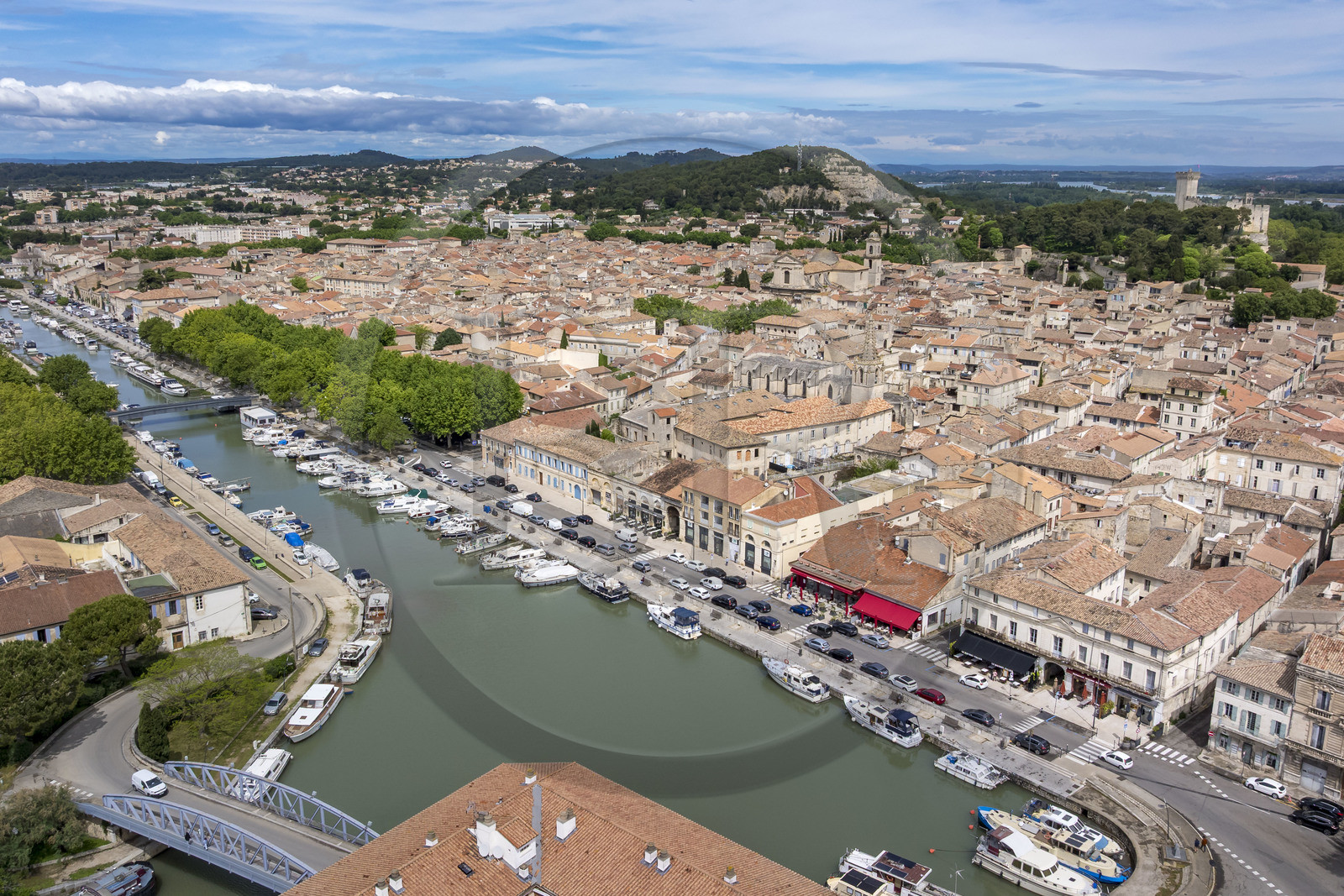 France, Gard, Beaucaire, the port of the Rhone to Sète Canal and the castle of Beaucaire in the background (aerial view)