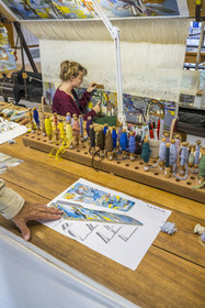 France, Herault, Lodève, Manufacture de la Savonnerie (Savonnerie manufactory) unique annex of the National Carpet Factory of the Savonnerie des Gobelins in Paris, realization by the weaver Kristell Corbinais on a loom of a seat tapestry for the bench L'Iris dans la vallée designed by Philippe Borderieux, mowing action