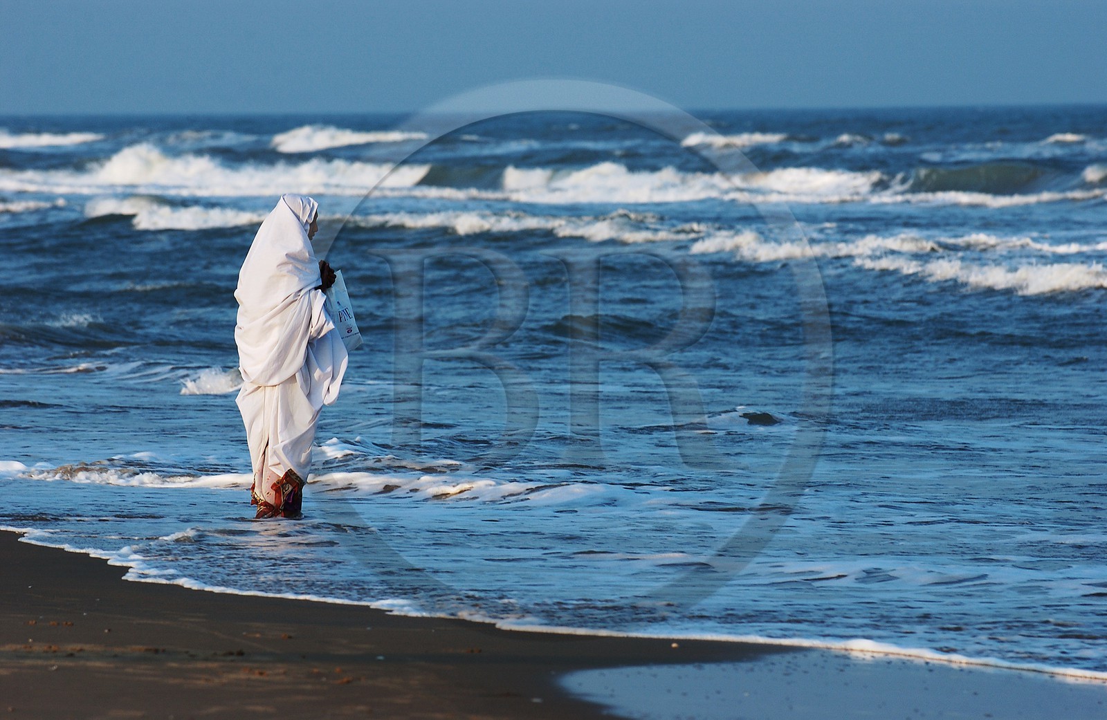 India, Pondicherry Territory, a woman in mourning dress on a beach of Pondicherry