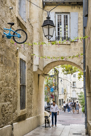 France, Herault, Montpellier, historic center called the Ecusson, street art rue Voltaire, one of the bikes embedded in the city walls by the artist Monsieur BMX