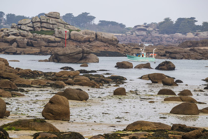 France, Cotes-d'Armor, Cote de Granit Rose, Perros-Guirec, fishing boat in the exit channel of the natural port of Ploumanac'h